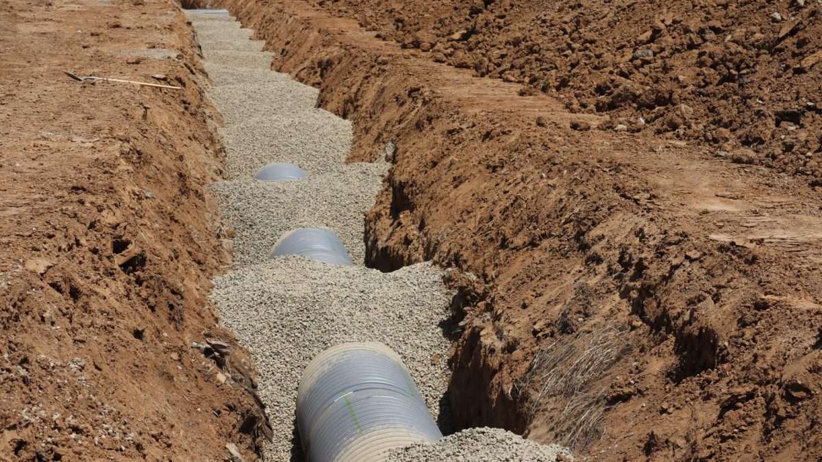 Water pipeline being laid in a trench